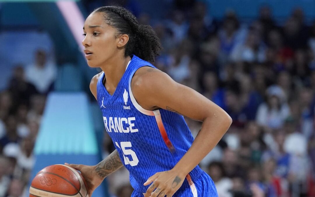 French basketball player dribbling during game