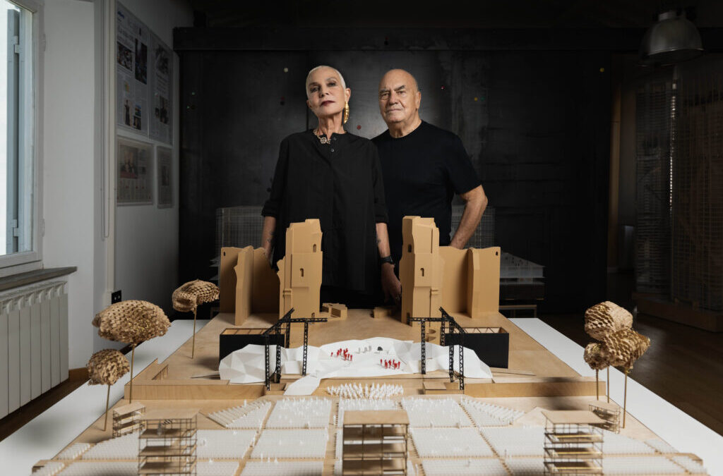 Two architects with building model.
