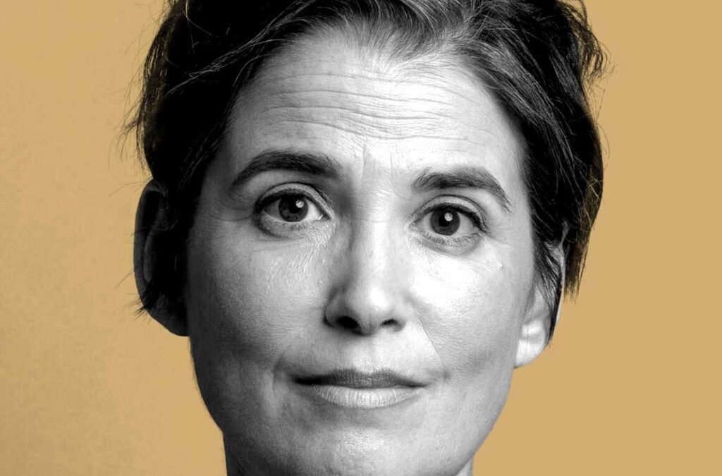 Woman with short hair on mustard background