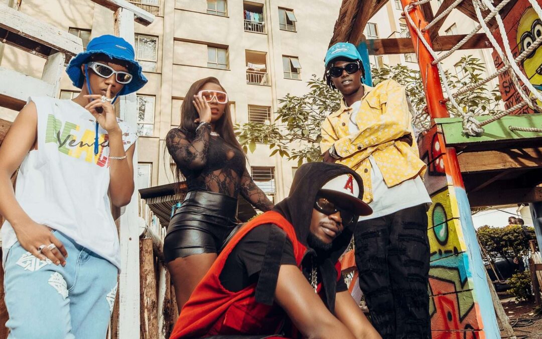 Group posing in urban setting with street art background.