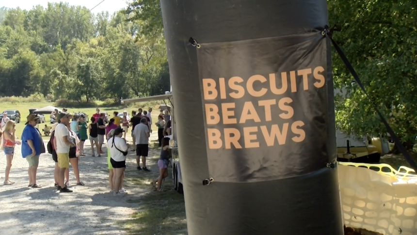 Event banner: Biscuits Beats Brews, people gathered around.
