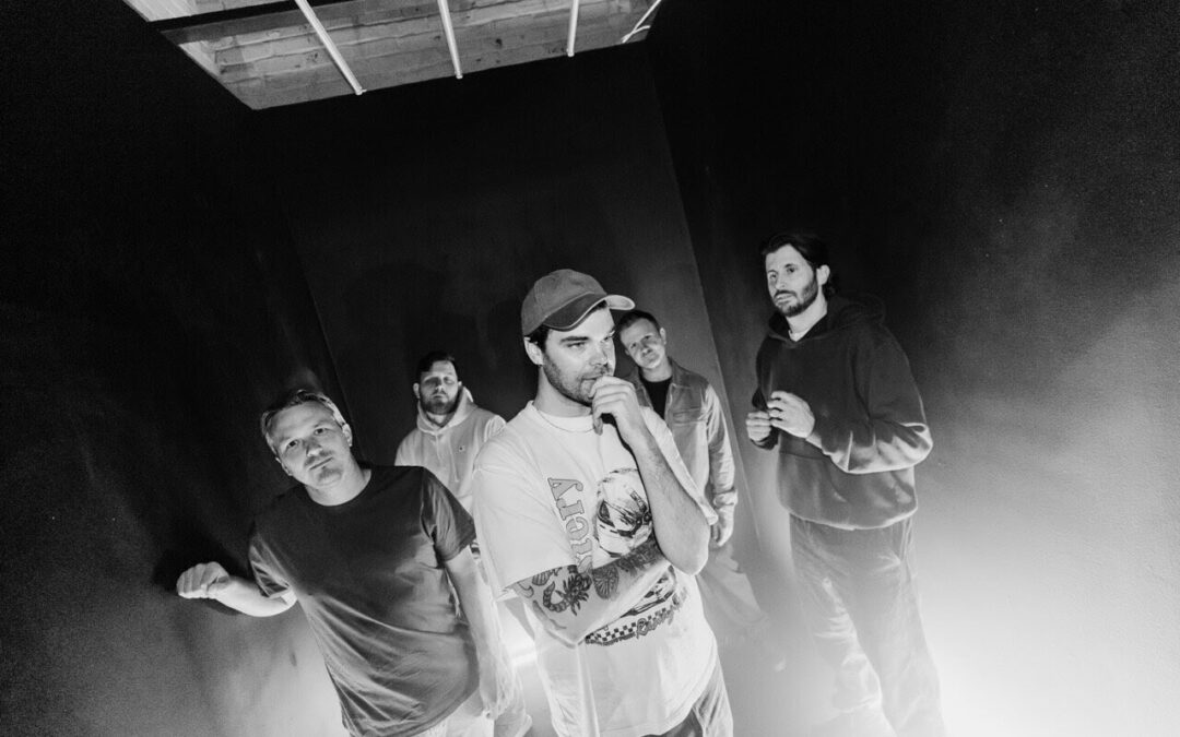 Black-and-white photo of five people standing together.