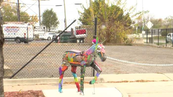 Colorful horse sculpture in parking lot