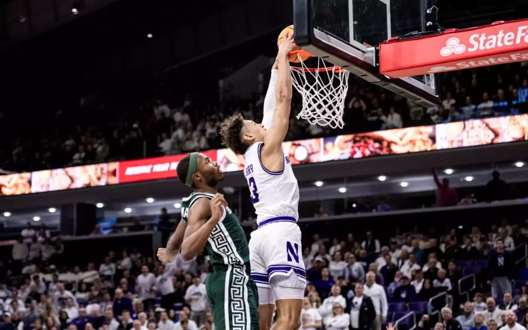 Basketball player dunking during a game.