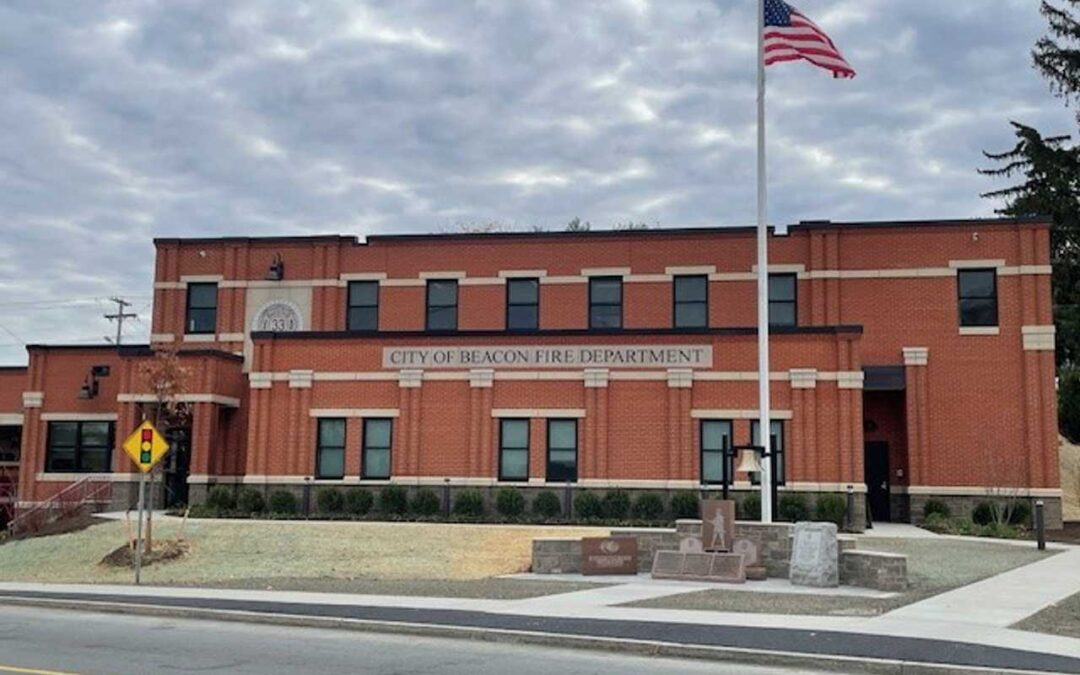 City fire department building with American flag.
