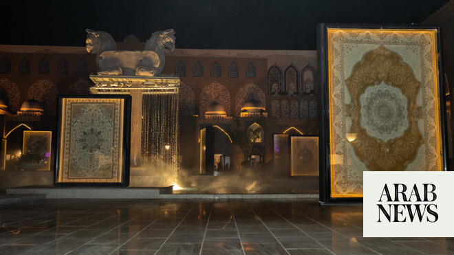 Exhibition of illuminated Persian carpets at night.