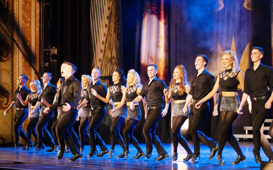 Irish dancers performing energetic routine on stage