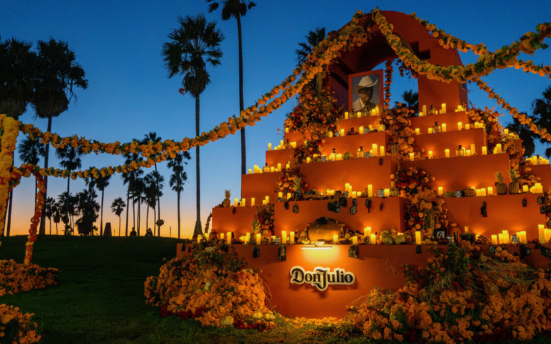 Day of the Dead altar with candles at sunset.