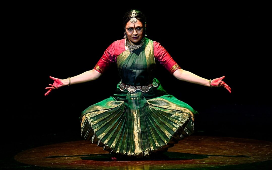 Bharatanatyam dancer performing on stage