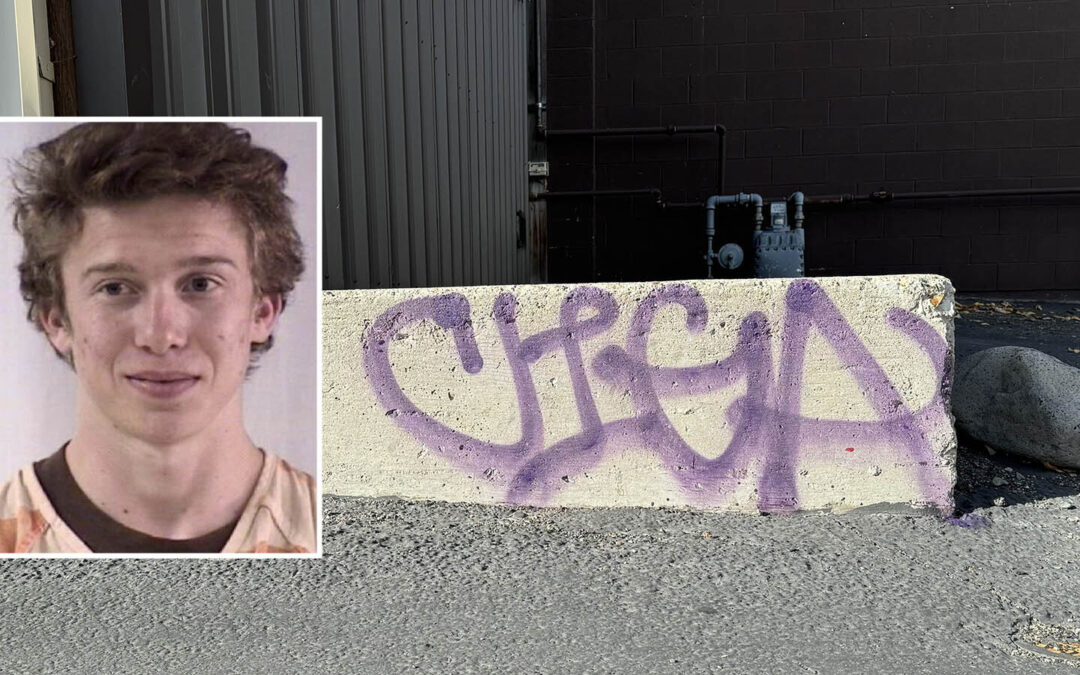 Graffiti on concrete barrier, inset of young man's photo.