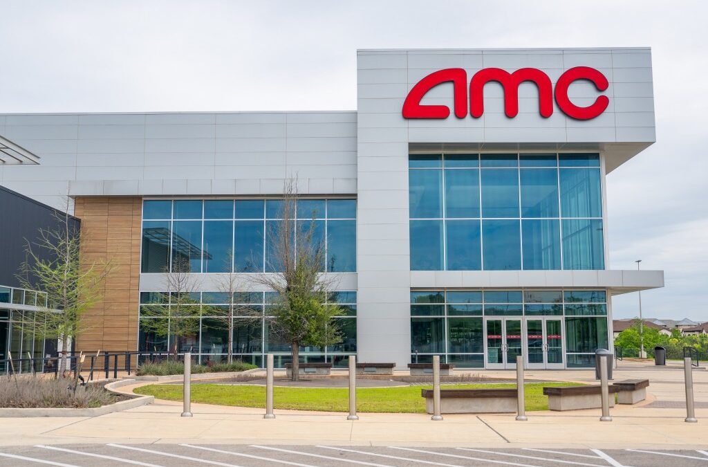 Modern AMC theater exterior view with glass windows.