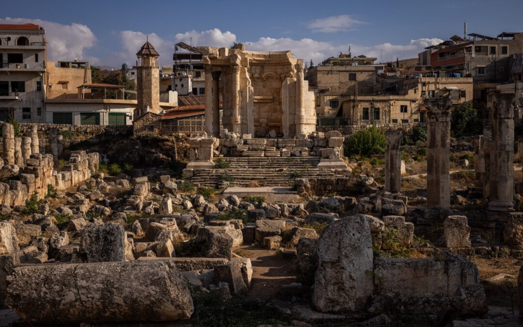Ancient ruins with columns and stone structures.
