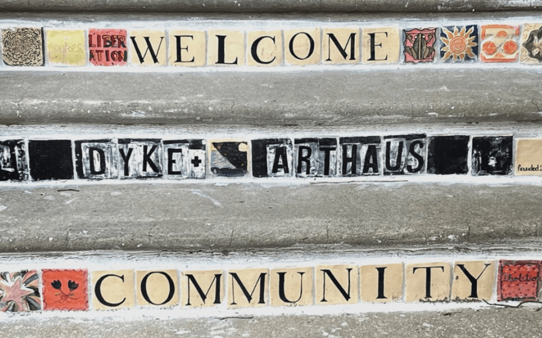 Mosaic steps with art and community welcome message.