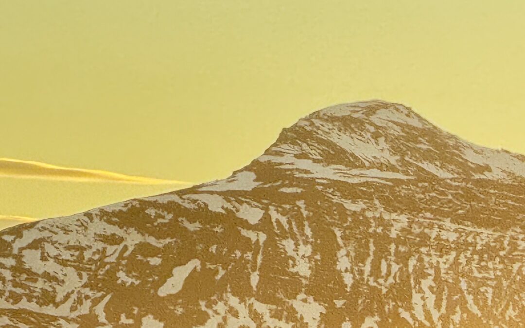 Snowy mountain peak at sunrise