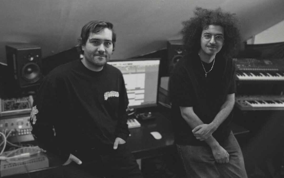 Two men in music studio with equipment