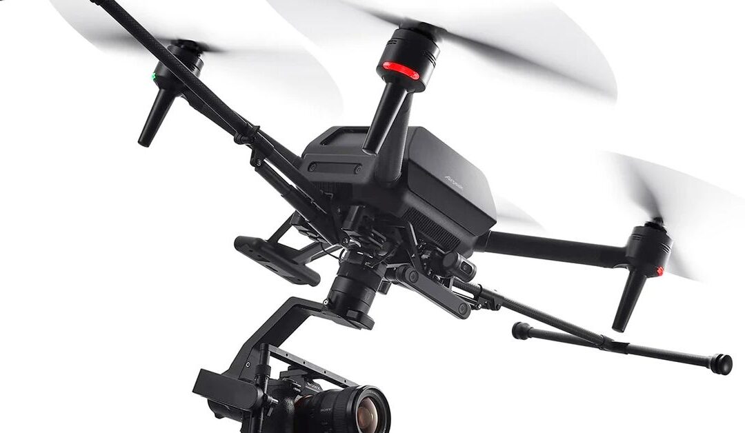Professional drone with attached camera in flight