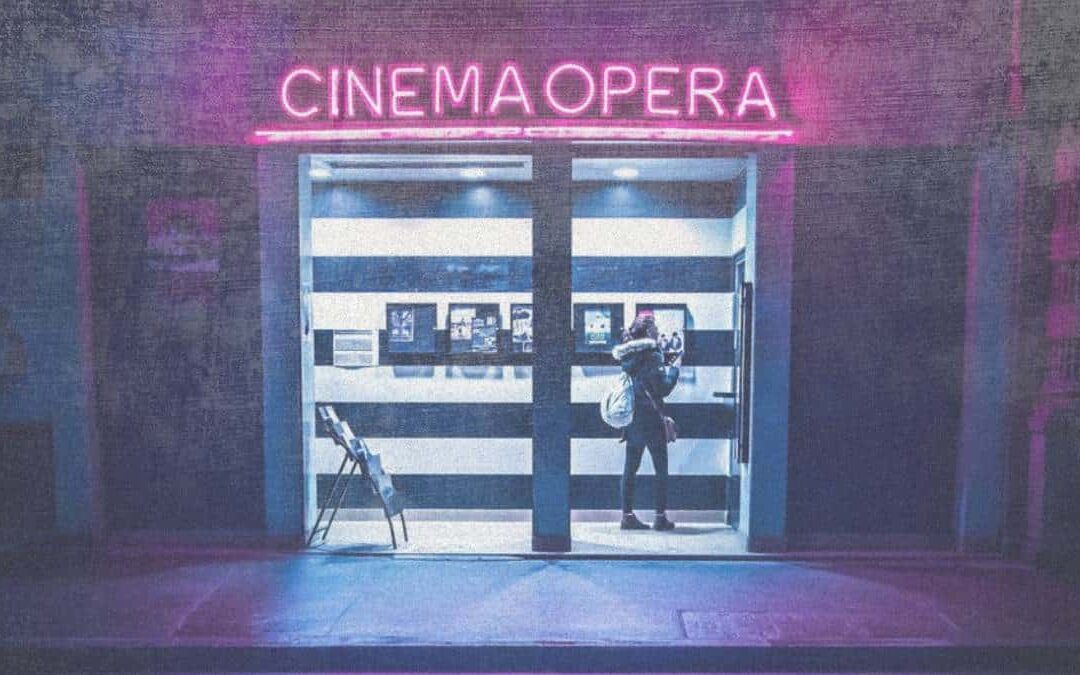 Neon Cinema Opera entrance at night.