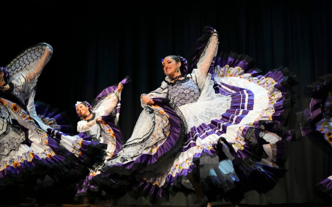 Women performing vibrant traditional folk dance.