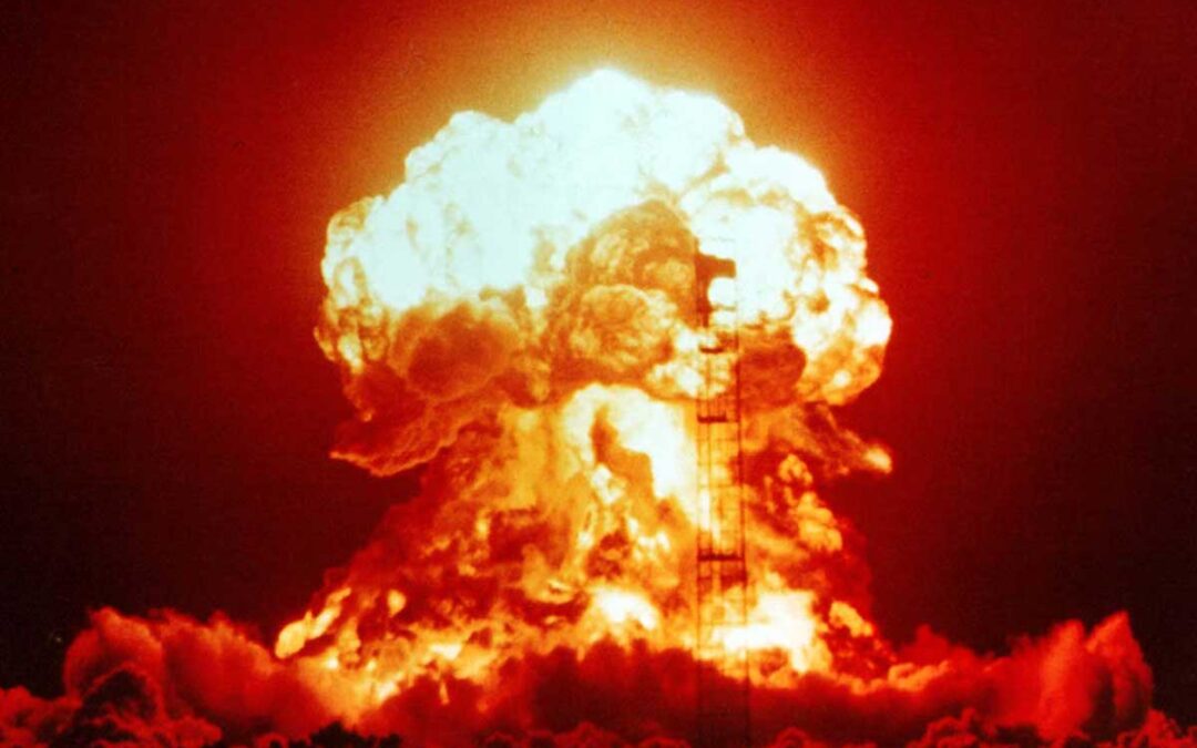 Nuclear explosion with fireball and mushroom cloud.