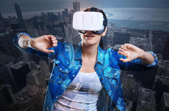 Person using VR headset over cityscape background.
