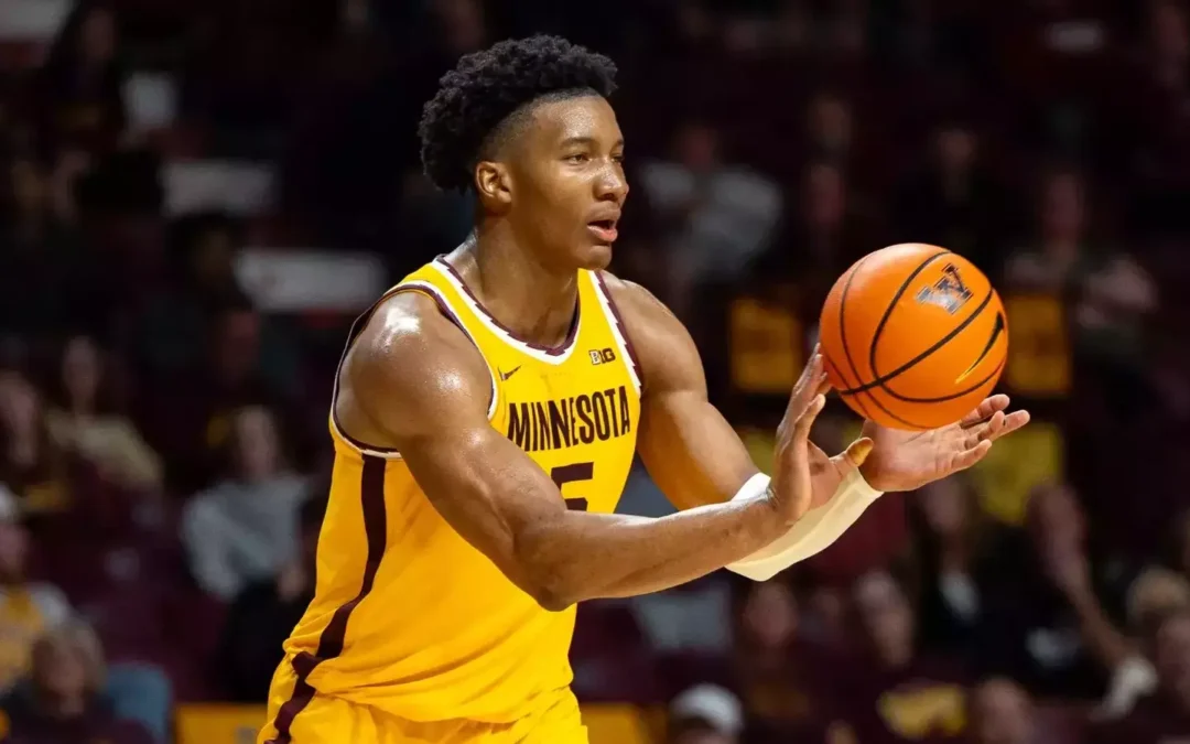 Basketball player in action, passing ball, Minnesota team