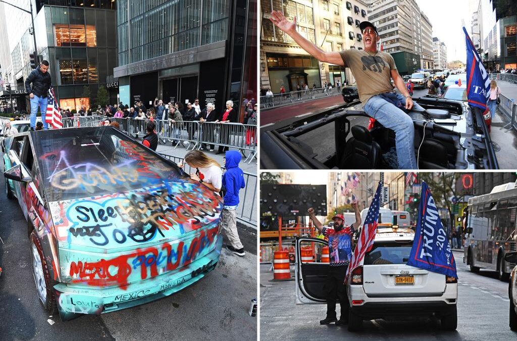 Protestors with flags and signs in city street.