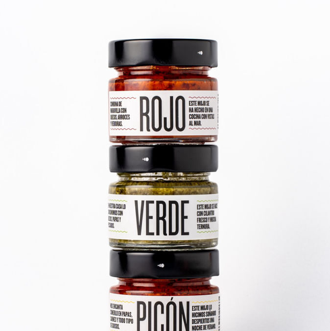 Stacked jars of colorful sauces.